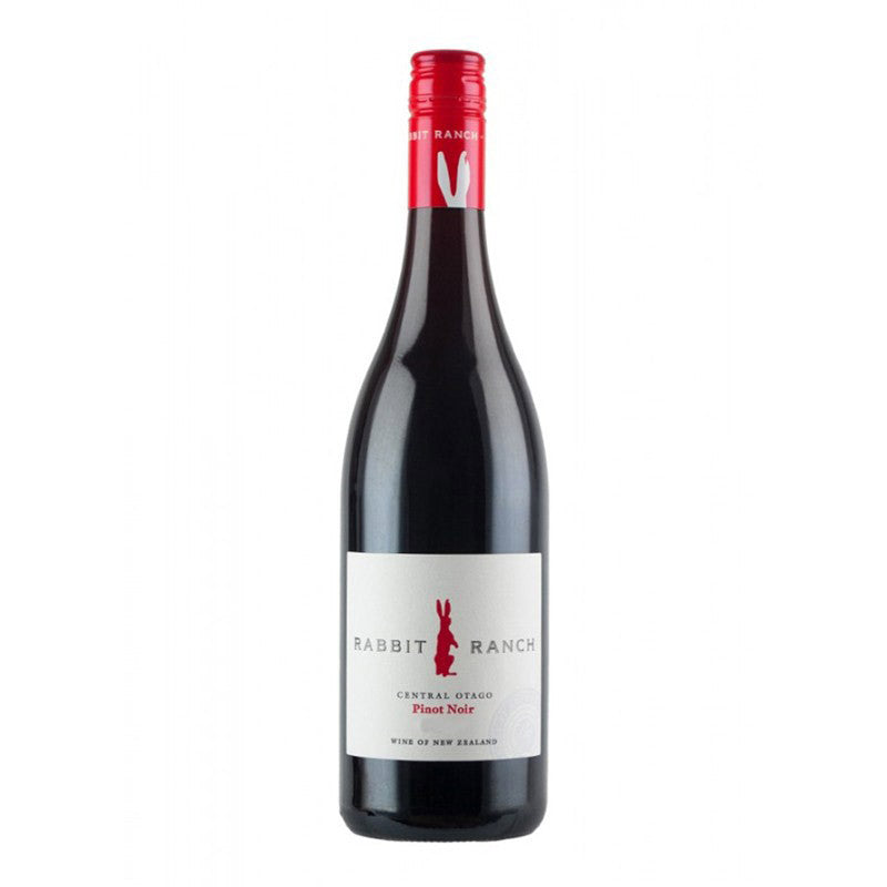 A bottle of Rabbit Ranch Pinot Noir wine with a red cap and a label that includes the name and the phrase 'Central Otago Pinot Noir'.