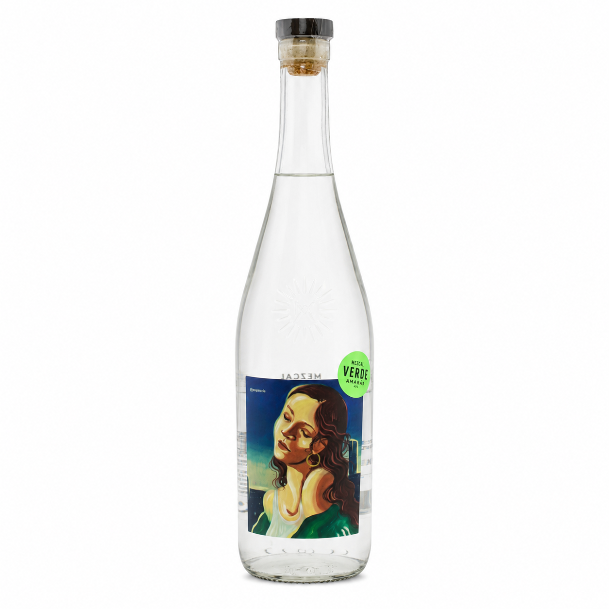 A clear glass bottle of Verso Non-Alcoholic Vermouth with a cork stopper and a colorful label featuring a woman's portrait, on a white background.