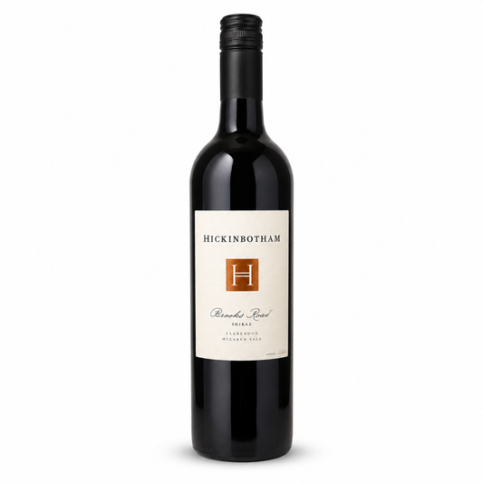 A bottle of Hickinbotham Brooks Roead 2023 Shiraz from the Clarendon McLaren Vale Region, featuring a black glass bottle, black screw cap, and a cream-colored label with a brown 'H' logo, set against a off white background.