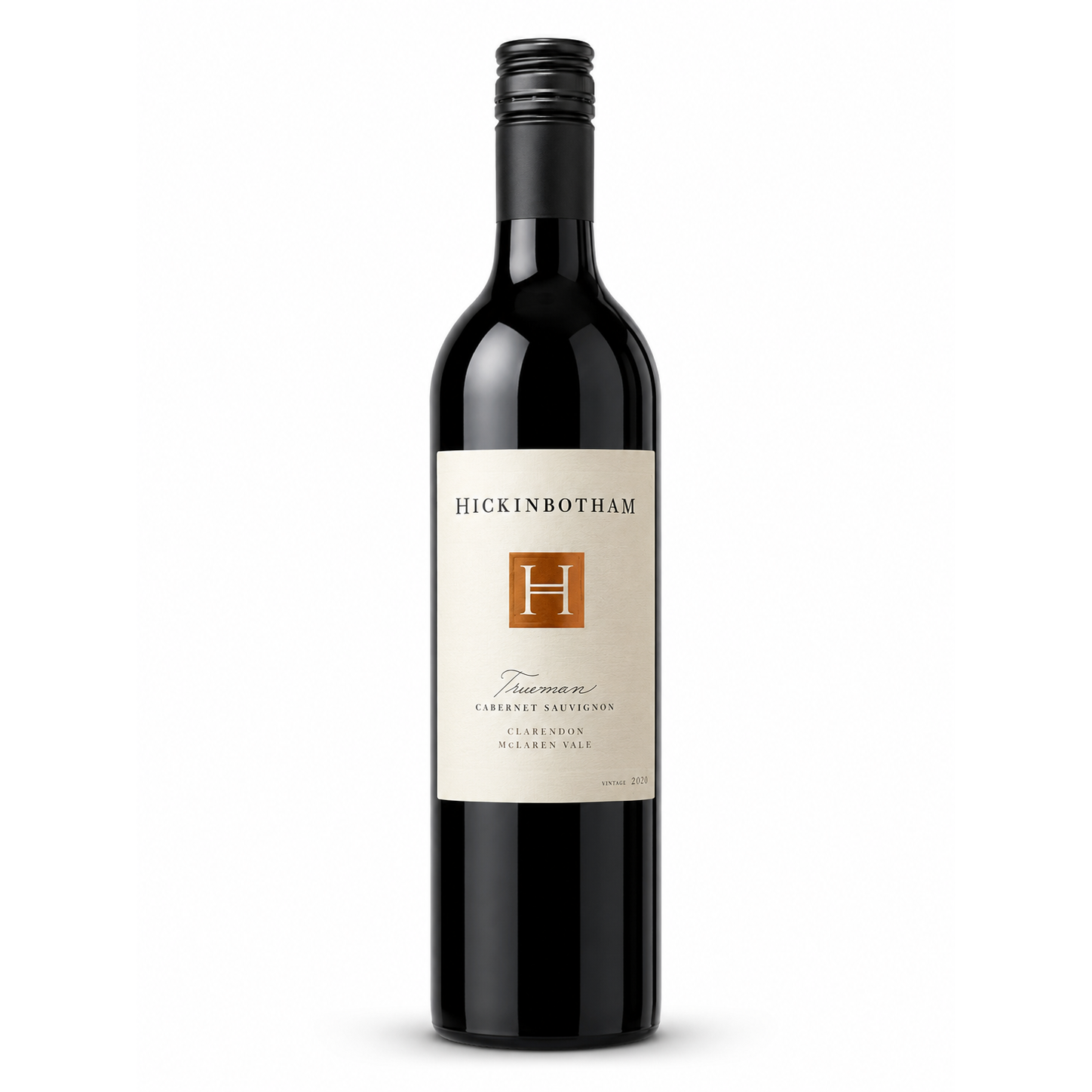 A bottle of Hickinbotham Trueman Cabernet Sauvignon from McLaren Vale, featuring a cream-colored label with a gold square logo and black text, set against a plain white background.