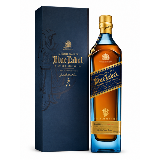 A bottle of Johnnie Walker Blue Label blended Scotch whisky next to its tall dark blue presentation box, shown on a clean white background.