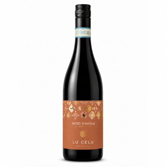 A bottle of Lu Celu Nero D'Avola red wine with a terracotta-colored label featuring gold floral patterns, set against a plain white background.