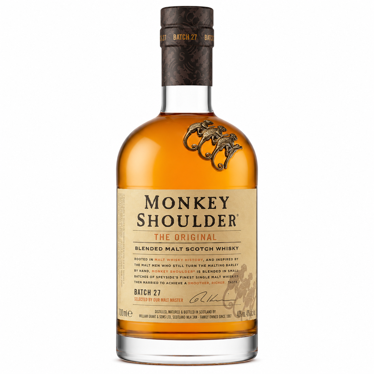 A bottle of Monkey Shoulder The Original Blended Malt Scotch Whisky, Batch 27, featuring amber liquid, a beige label, and a dark brown neck wrap on a white background.