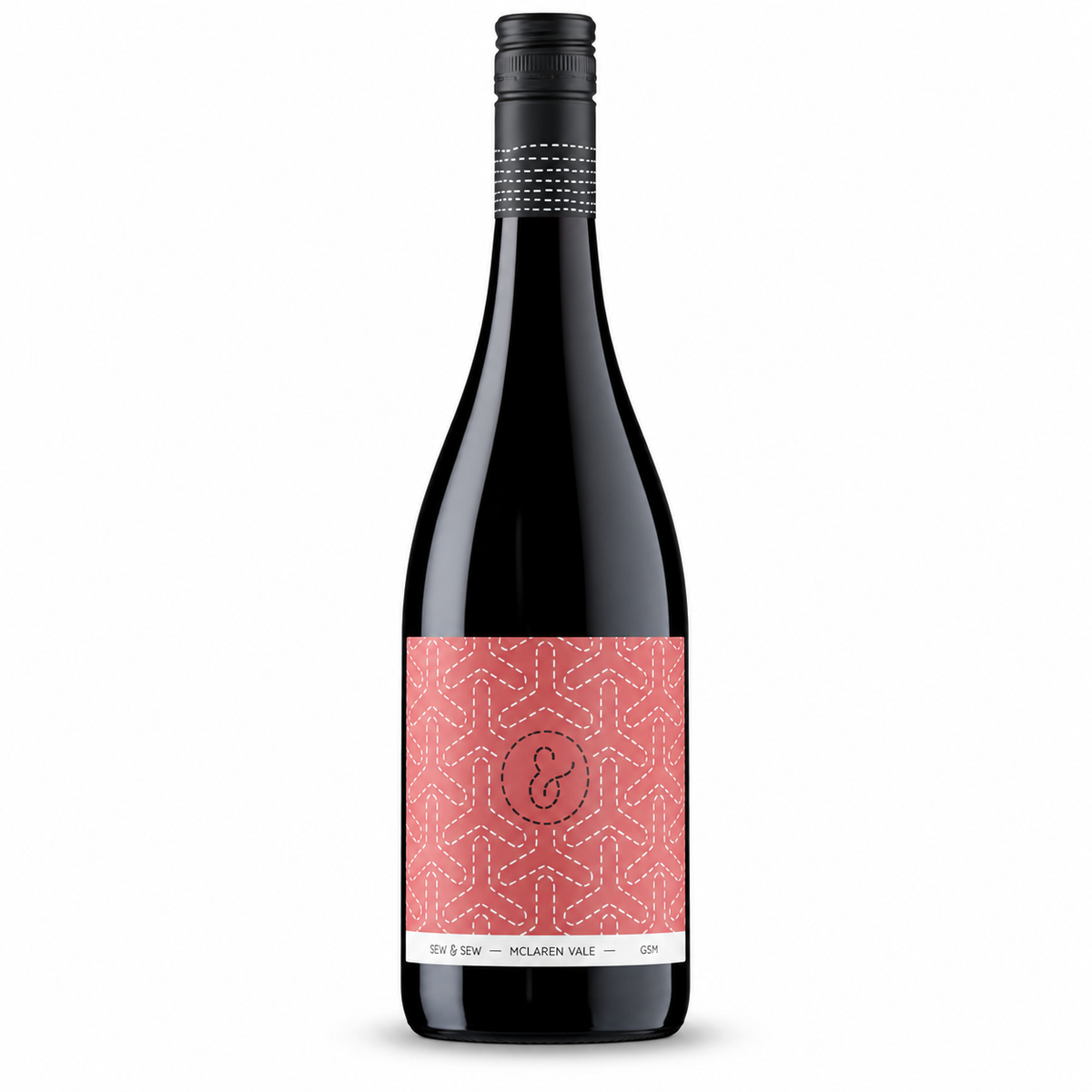A bottle of Sew & Sew GSM, a dark red wine bottle with a black cap and a coral pink patterned label. 