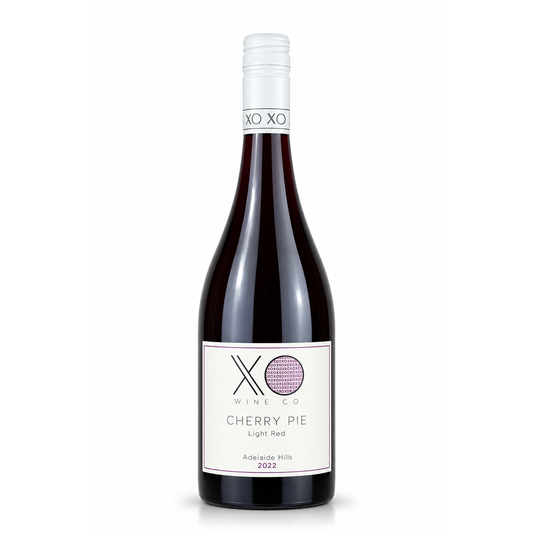 A bottle of XO Wine Co. Cherry Pie Light Red wine, featuring a dark glass bottle with a white label and a silver foil capsule at the neck, set against a plain white background.
