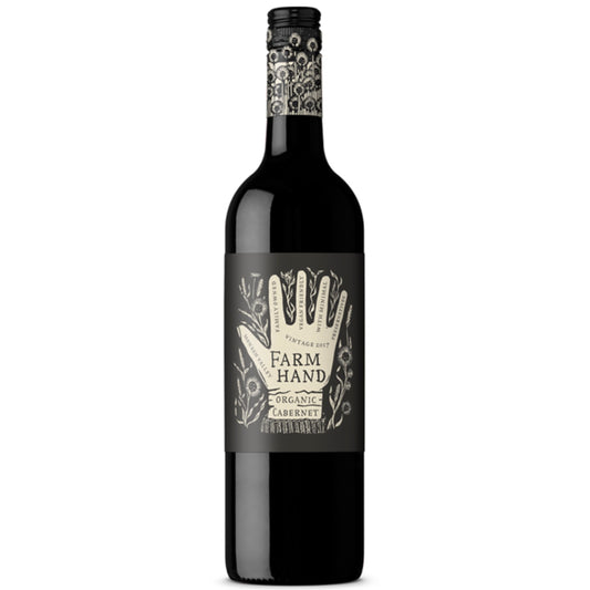 A bottle of Farm Hand Organic Cabernet Sauvignon with a dark label and organic certification logo.