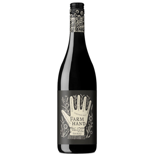 A bottle of Farm Hand Organic Shiraz wine with a label that features a hand and organic symbols.