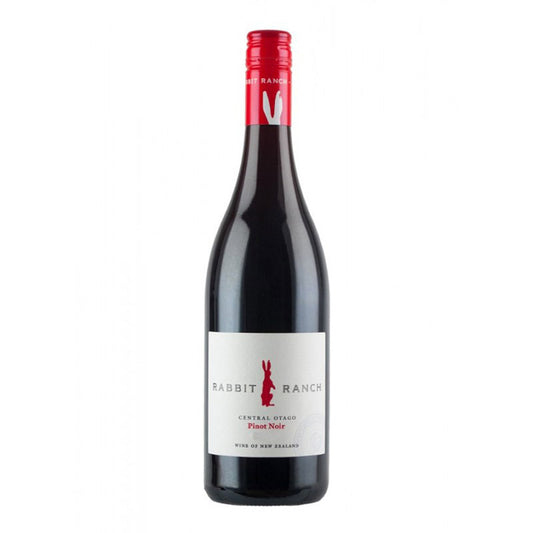 A bottle of Rabbit Ranch Pinot Noir wine with a red cap and a label that includes the name and the phrase 'Central Otago Pinot Noir'.
